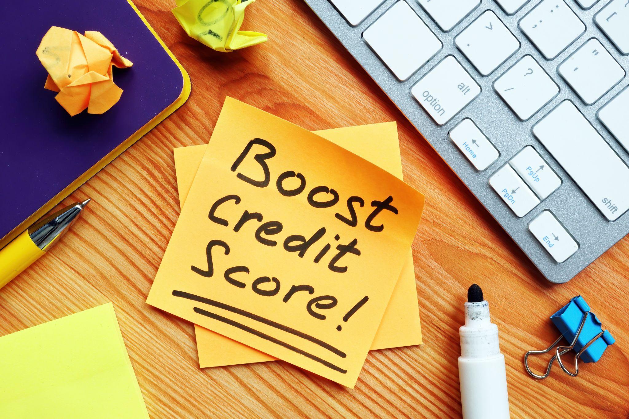 boost-credit-score-mark-on-the-orange-piece-of-paper Boost Your Credit
